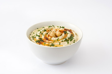 Hummus in bowl isolated on white background