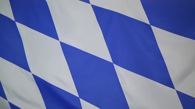 Textile flag of Bavaria, Germany moving in the wind