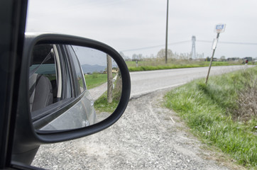Country road seen from the mirror