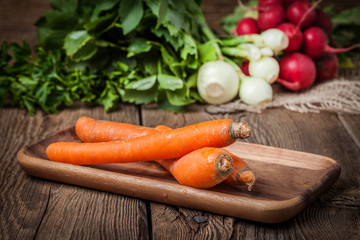 Fresh vegetables on a wooden table.