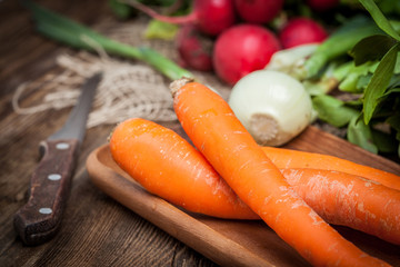 Fresh vegetables on a wooden table.