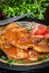 Potato pancakes with meat stew served on a plate.