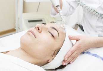 Fototapeta na wymiar process of female massage cosmetic mask in a beauty salon