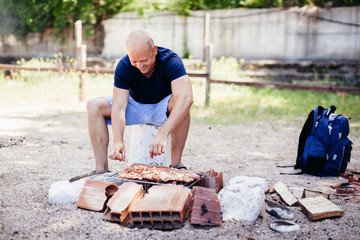 man cooking bbq