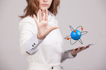Woman scientist with atom model, research concept