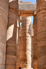 Columns painted in the Ancient temple Karnak in Luxor. Egypt.