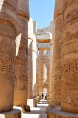 Columns painted in the Ancient temple Karnak in Luxor. Egypt.