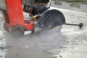 Construction site, asphalt cutting tool at road construction site