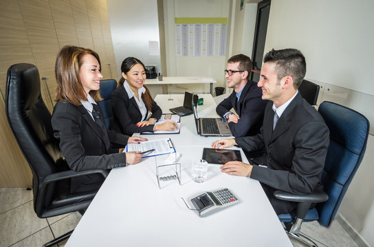 Group of multiracial business people talking at the office