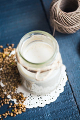 vegan fresh milk from hemp seeds in a glass jar, clean eating