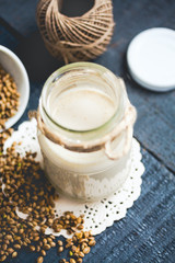vegan fresh milk from hemp seeds in a glass jar, clean eating