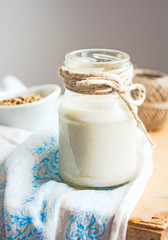 vegan fresh milk from hemp seeds in a glass jar, clean eating