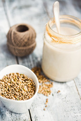 vegan fresh milk from hemp seeds in a glass jar