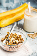 granola with cashews and banana, vegan milk