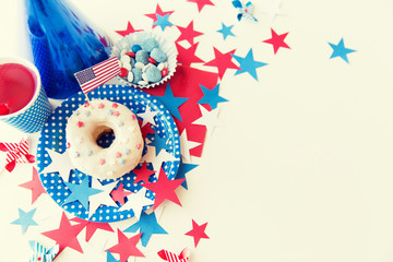 Fototapeta na wymiar donut with juice and candies on independence day