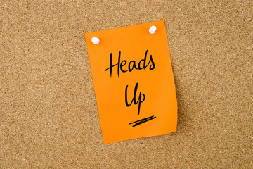 Heads Up written on paper note - 110078313
