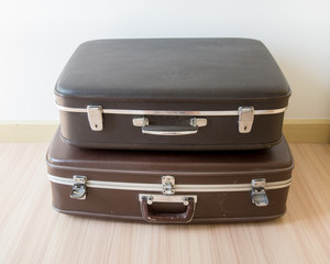 Old suitcases. Brown and black retro suitcase. Vintage baggage.