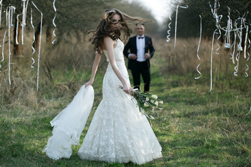 Wedding couple walking outdoor