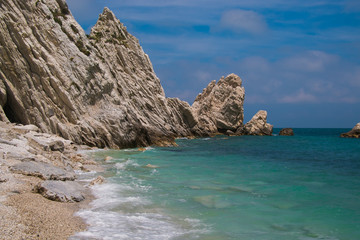 The famous beach of two sisters (Spiaggia delle due sorelle) at Conero park in Italy.