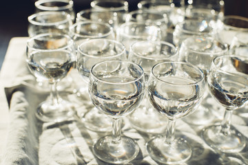 Traditional Hungarian palinka in transparent glasses on table