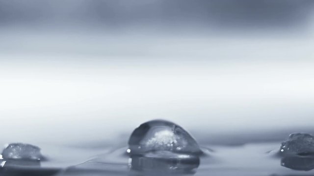 Thawing ice cube close-up timelapse 4k (4096x2304)
