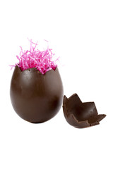 cracked chocolate egg and pink confetti