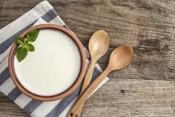 Fototapeten Homemade yogurt on wooden table © sebra