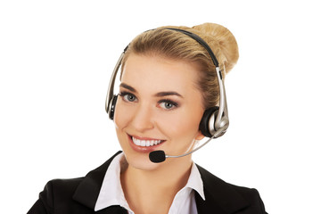 Happy young businesswoman with headset