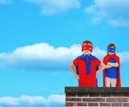 Composite image of masked kids pretending to be superheroes