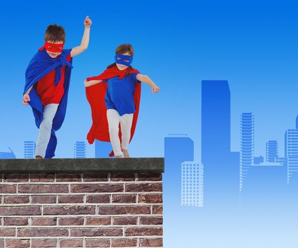 Composite image of masked kids walking pretending to be superher