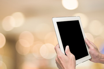 One using tablet pc and bokeh background