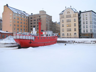 The photo is took in the winter at Helsinki, Finland, Boats on the winter parking, frozen on sea ice