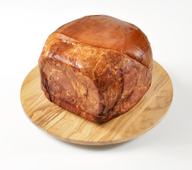 smoked whole ham on cutting board