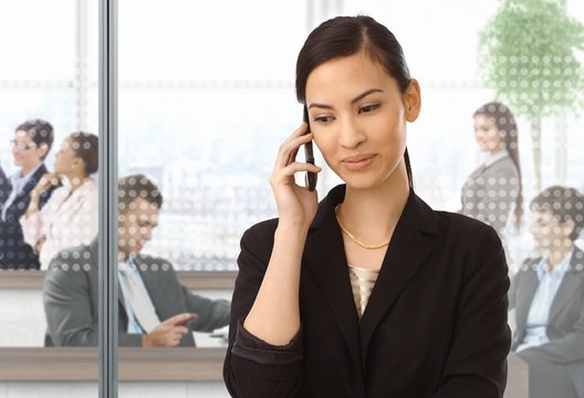 Asian businesswoman on the phone at office
