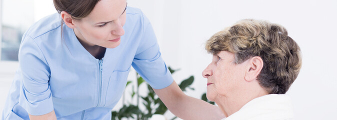 Helpful nurse and sick patient