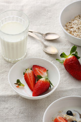 making morning cereal with strawberry