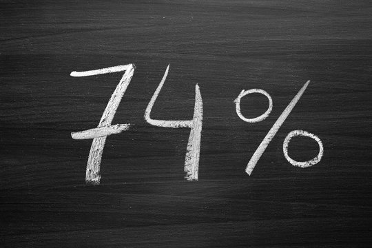 74 percent header written with a chalk on the blackboard