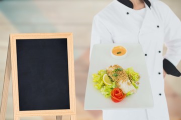 Composite image of a cook holding vegetables