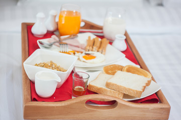 Breakfast set in wooden tray
