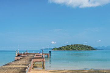 A wooden Bridge and clear blue sky and sea