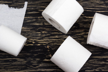 Toilet paper on wooden board