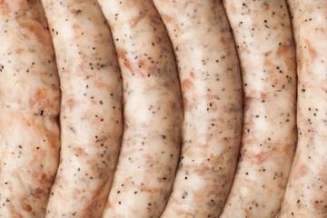 raw meat sausages, closeup view