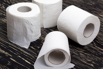 Toilet paper on wooden board