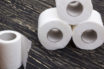 Toilet paper on wooden board