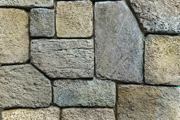 Uneven rock brickwork for wall or road.