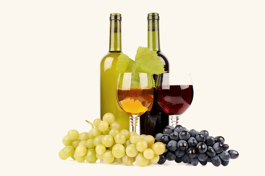 isolated wine bottle with glass and green grapes