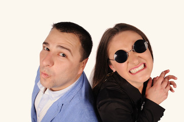 Man and woman with funny faces isolated over white background