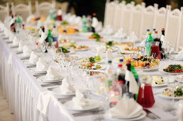 Served table in restaurant with dishes and glasses