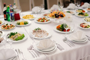 table set service with silverware and glass stemware at restaura