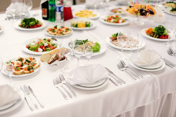 Fototapeta premium table set service with silverware and glass stemware at restaura